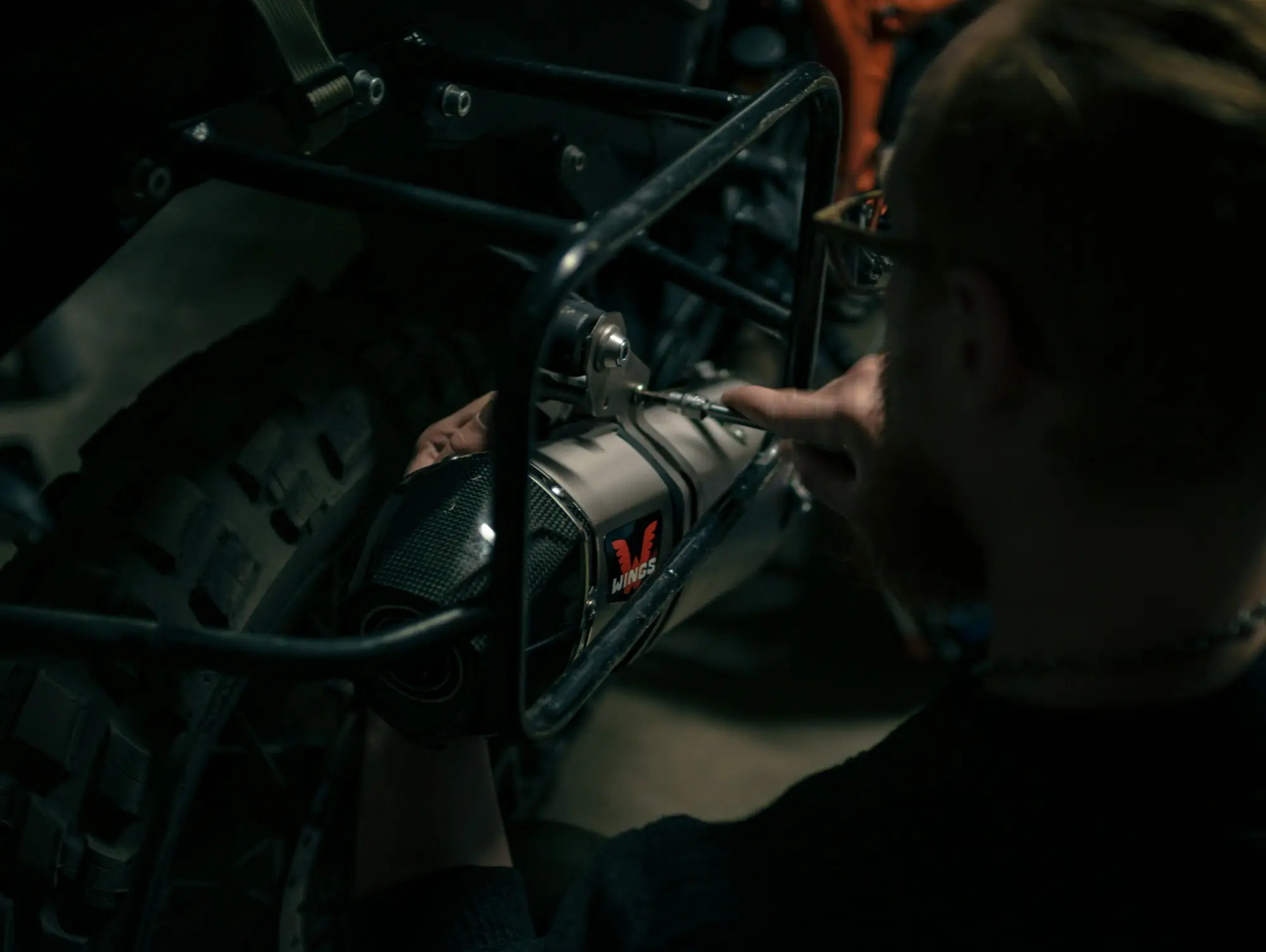 Mechanic working on an engine in a workshop