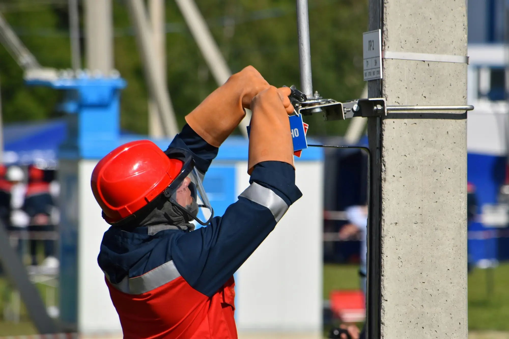 Tradesman in an orange safety helmet on site