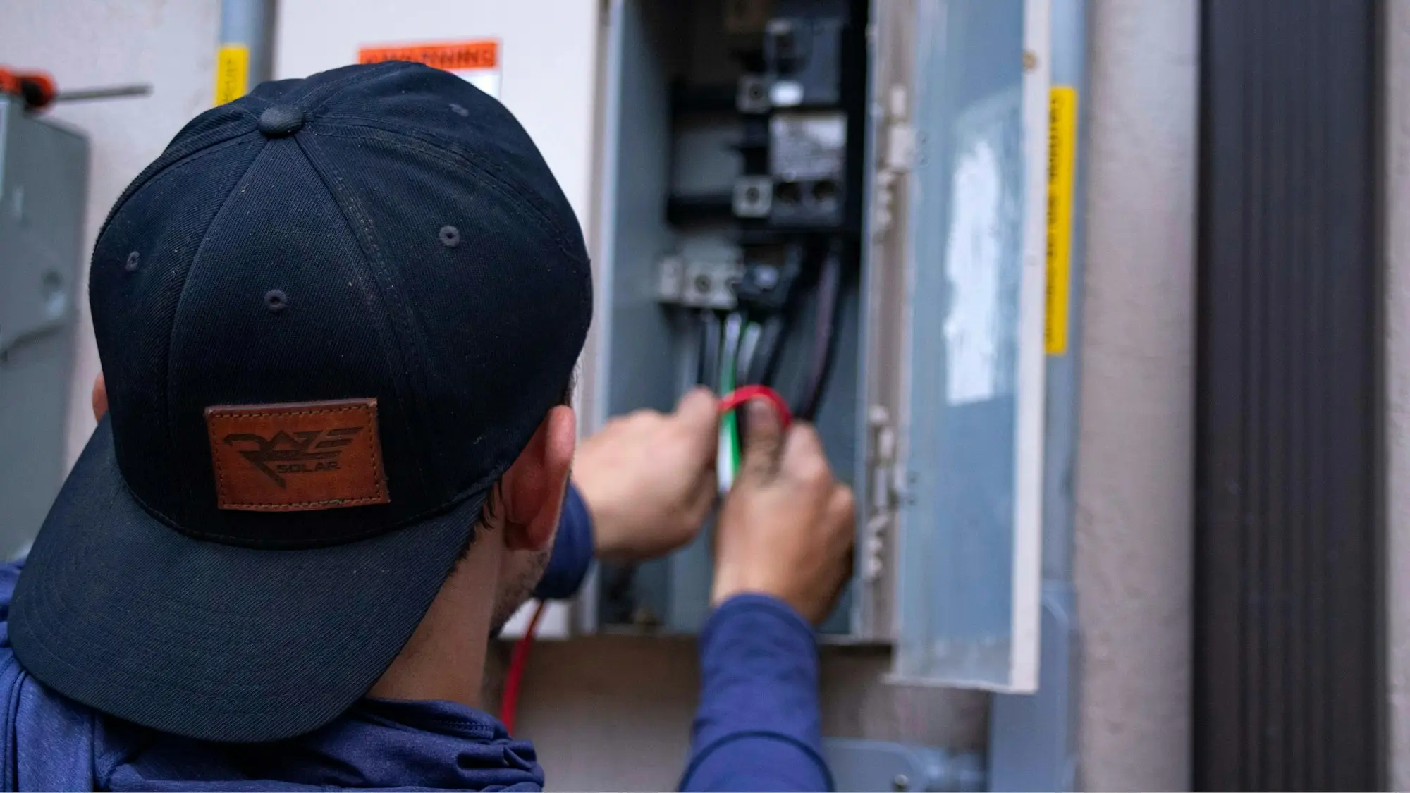 Tradesman operating a machine in a workshop